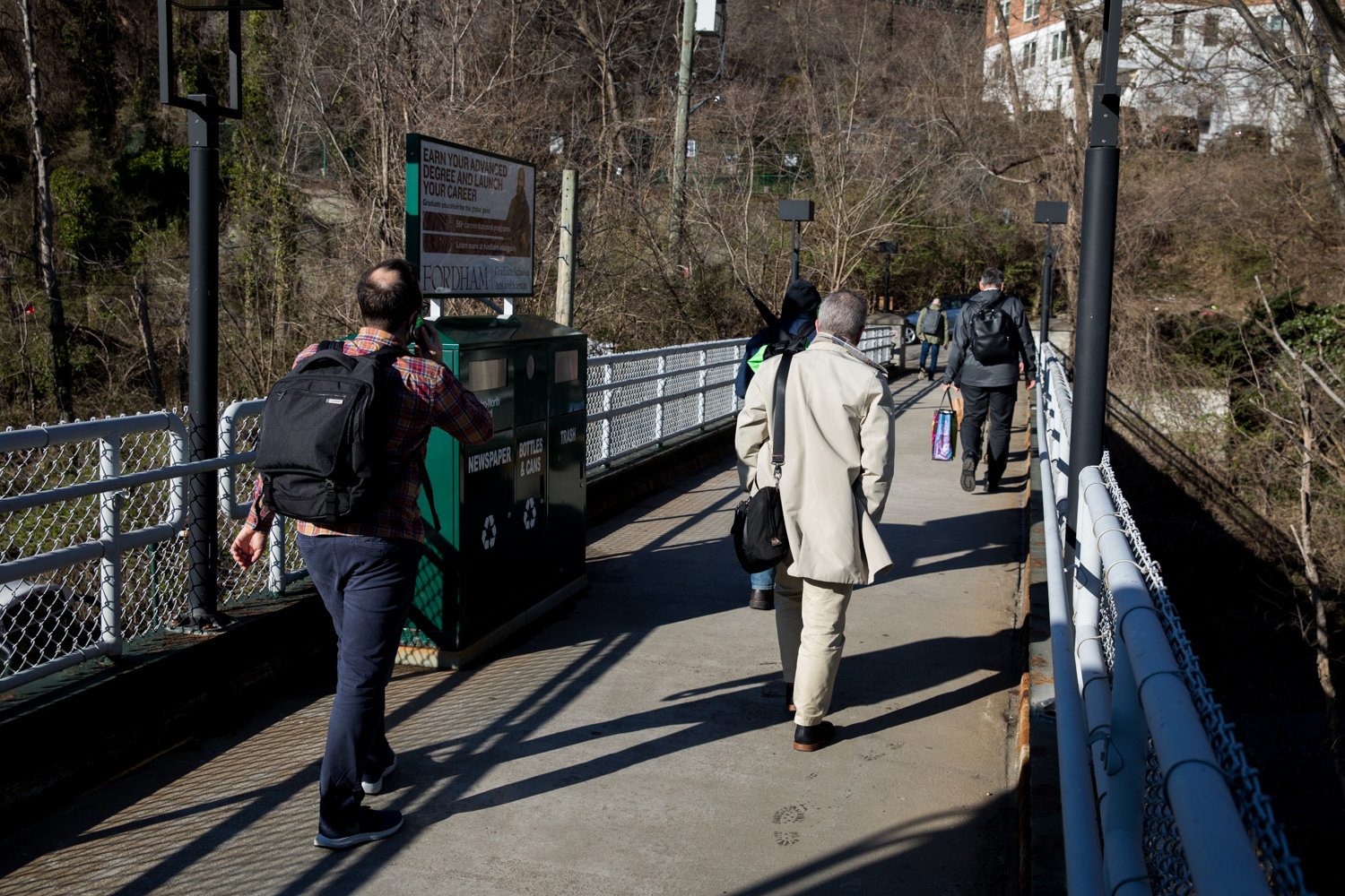 Commuters walk toward the north end of Edsall Avenue after climbing the stairs from the Spuyten Duyvil Metro-North station. It’s a journey after the trip that some cannot take because of disabilities, and a lack of elevator at the station.