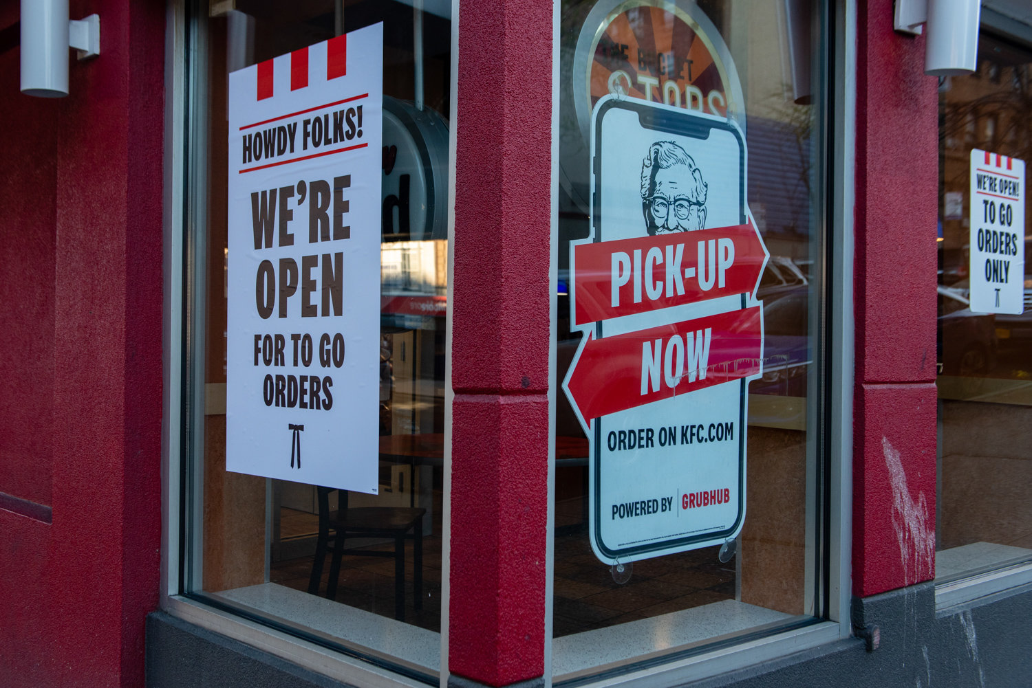 Signs inform passersby that the Kentucky Fried Chicken on Broadway is open for to-go orders. The partially closed business is a familiar sight in the weeks since the state’s shutdown in response to the coronavirus pandemic, which Frida Sternberg captured for her project documenting the new normal.