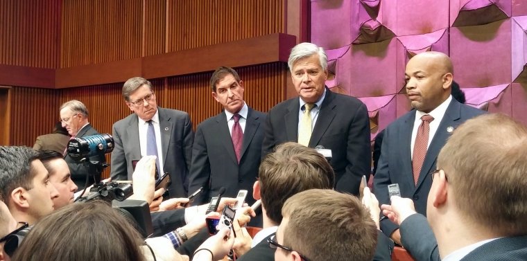Former state senate majority leader Dean Skelos, second from right, joins state Sen. Jeff Klein and other senators in 2015 as talks begin for the state budget that year Skelos, who would later be convicted on corruption charges, is leaving prison early after being exposed to the coronavirus that causes COVID-19.