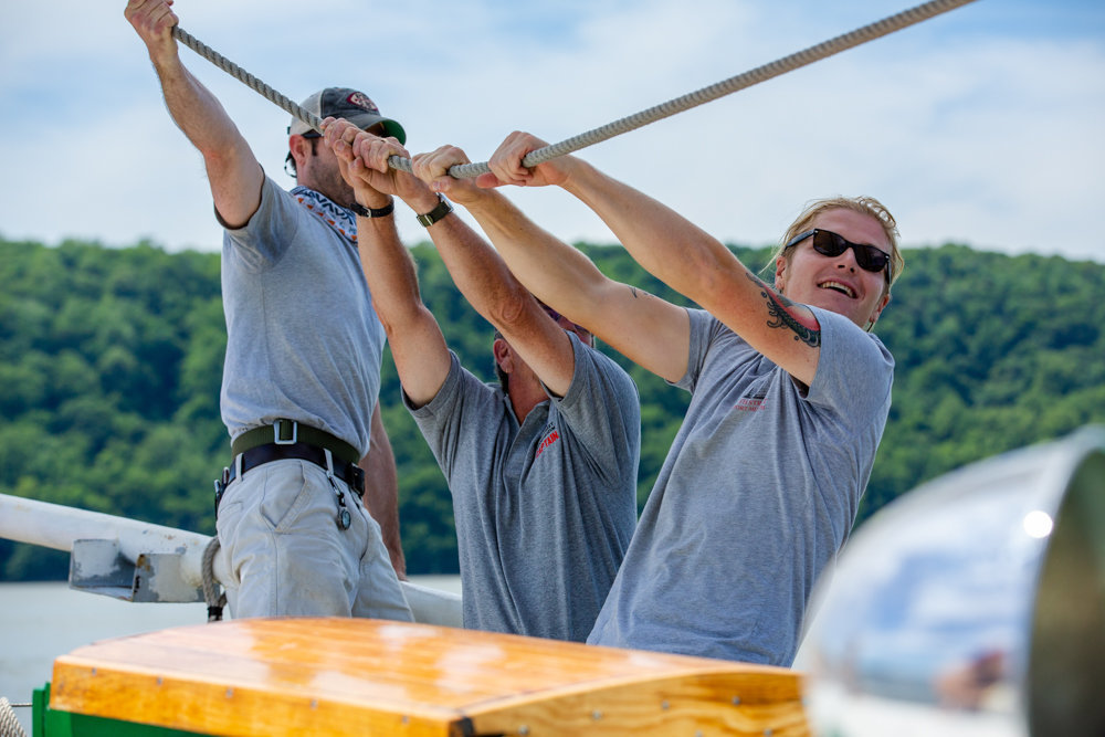 Gabriel Peterson, right, leads a group of crewmembers tacking the mainsail aboard the Pioneer schooner at RiverFest. Because of the coronavirus pandemic, the organizers behind RiverFest have canceled this year's celebration of the Hudson River.