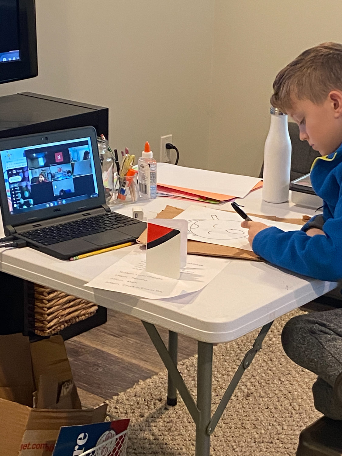 Quinn, son of Riverdale Presbyterian Church Nursery School director Tara Mastin, attends class over the videoconferencing app Zoom.