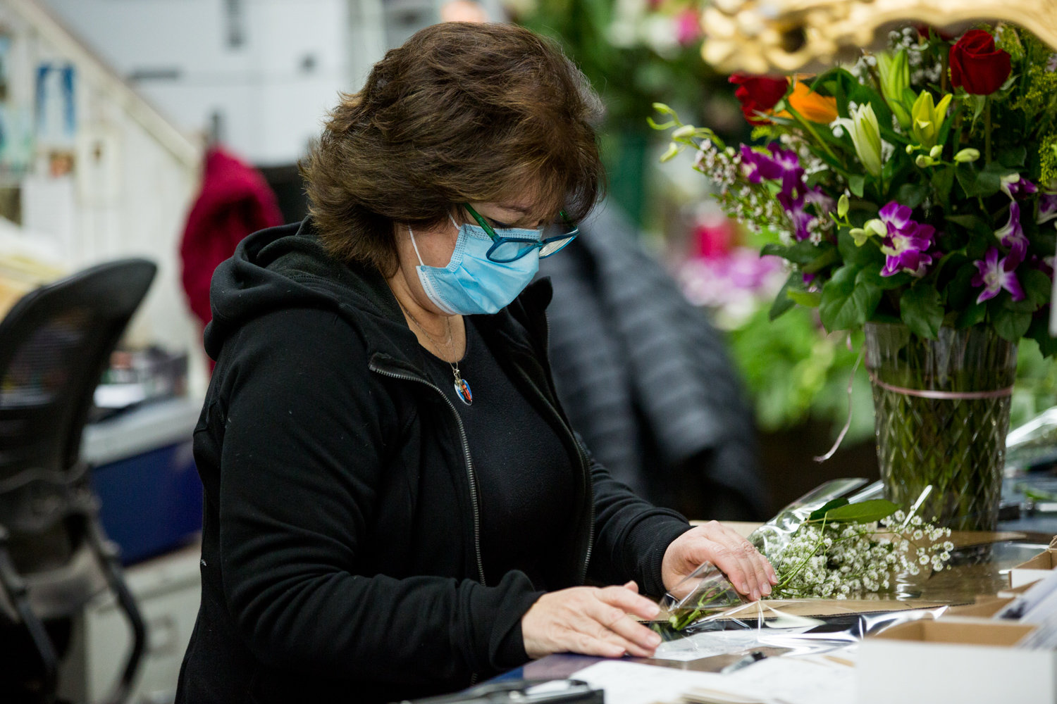 Columbia Florist co-owner Katherine Capsis prepares an order for a customer two days ahead of Mother’s Day. The West 231st Street flower shop has managed to stay open even though many of its neighbors closed temporarily in the wake of the coronavirus pandemic.