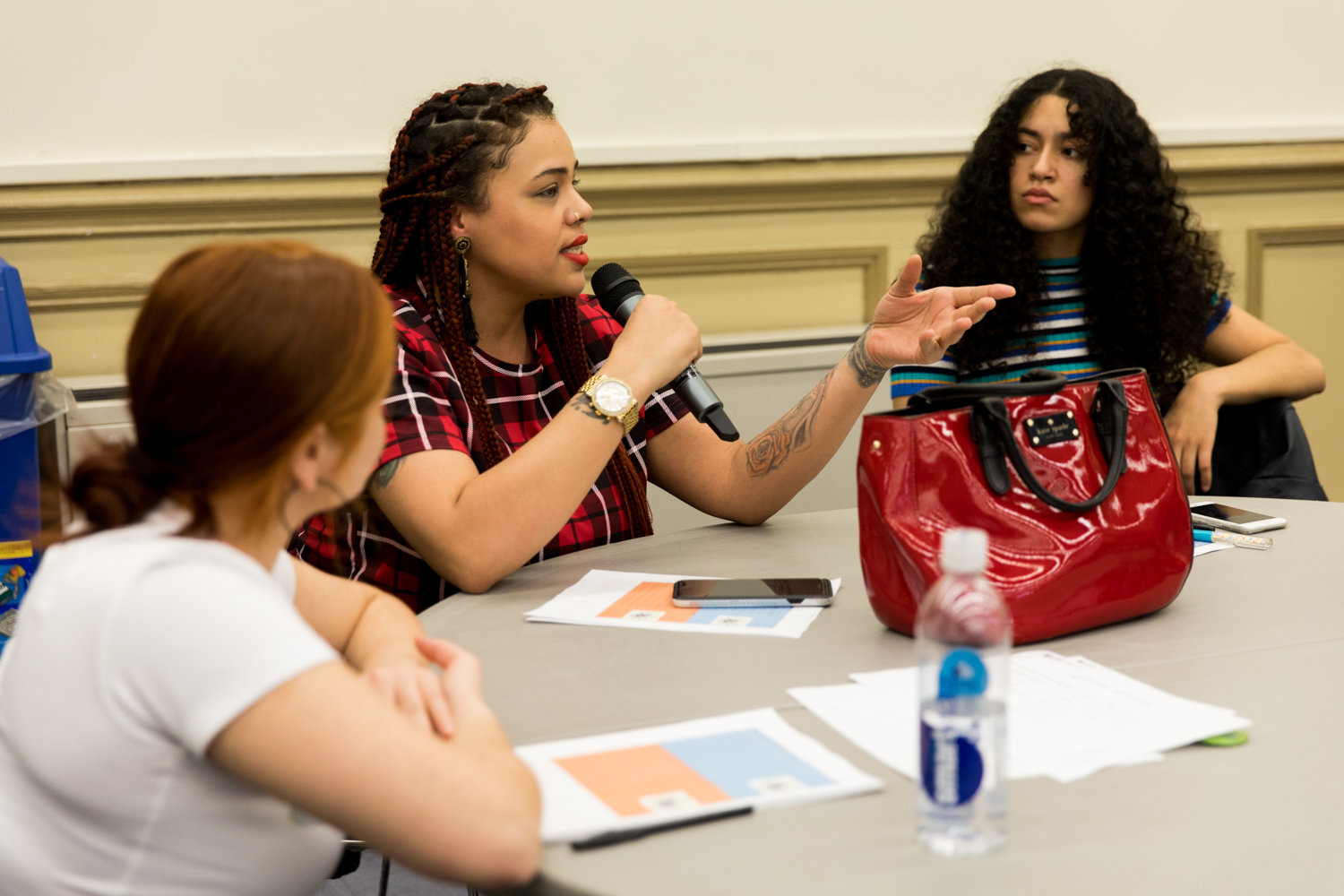 Lehman College student Emily Garcia talks about the rising cost of food during a March 9 forum hosted by the CUNY Rising Alliance that sought to address a wide variety of students’ concerns, including possible tuition hikes.