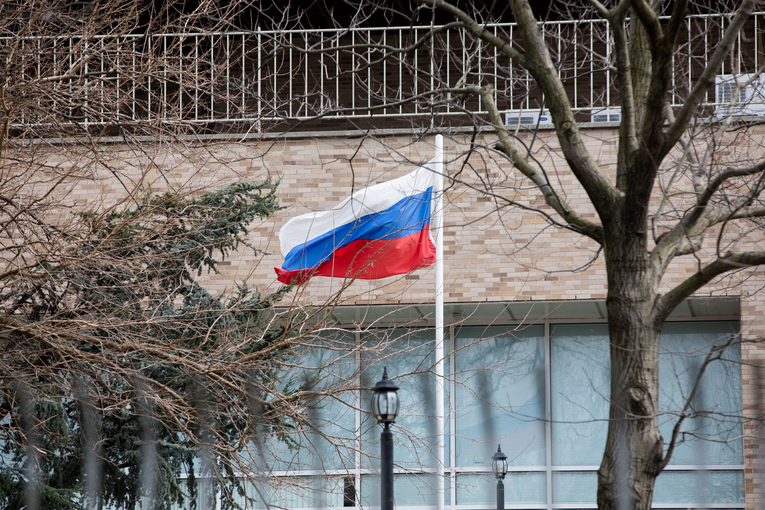 The Russian flag waves in the wind in front of the Russian Mission on Mosholu Avenue.
