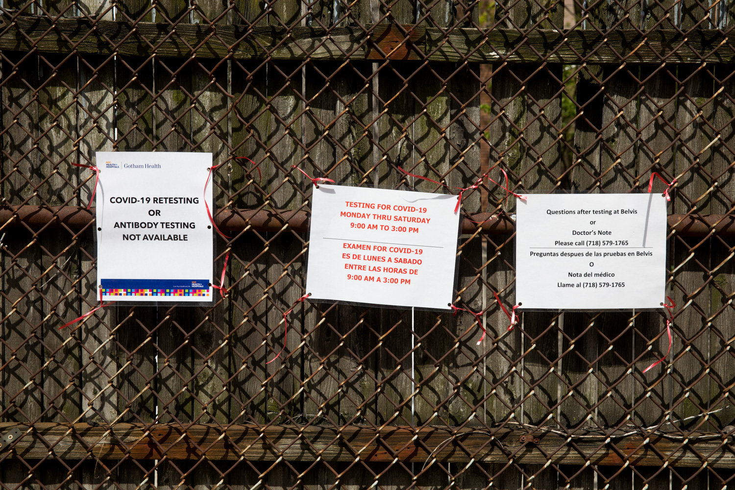 Signs posted outside of NYC Health + Hospitals/Gotham Health, Belvis, clarify hours of operation and what kinds of diagnostic tests are available for the coronavirus that causes COVID-19.