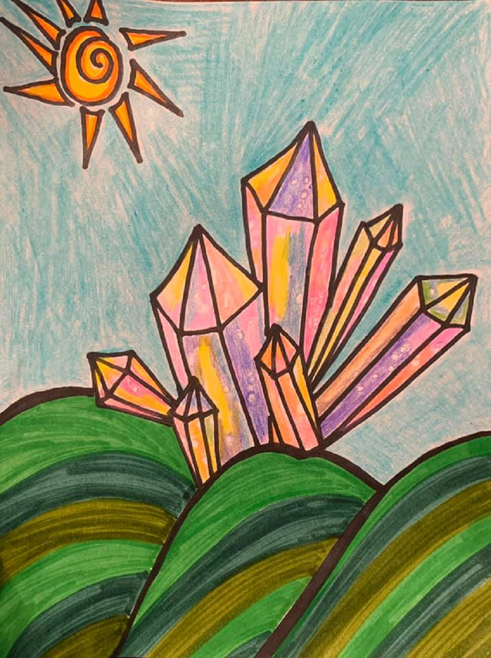 Nina Velazquez got a bit experimental with one of her drawings when she added some crystals to a landscape. She posted it on Facebook so that families and children staying home during the pandemic could draw their own versions of it.