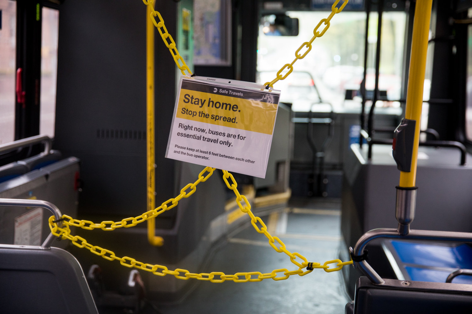 A sign hangs in front of a roped-off section of a bus informing passengers that buses citywide are for essential travel only. The city’s bus network is one of the hardest hit areas of the MTA since the advent of the coronavirus pandemic, which has seen ridership plummet. Mayor Bill de Blasio has decided to defund the Better Buses Action Plan, intended to speed up bus service.