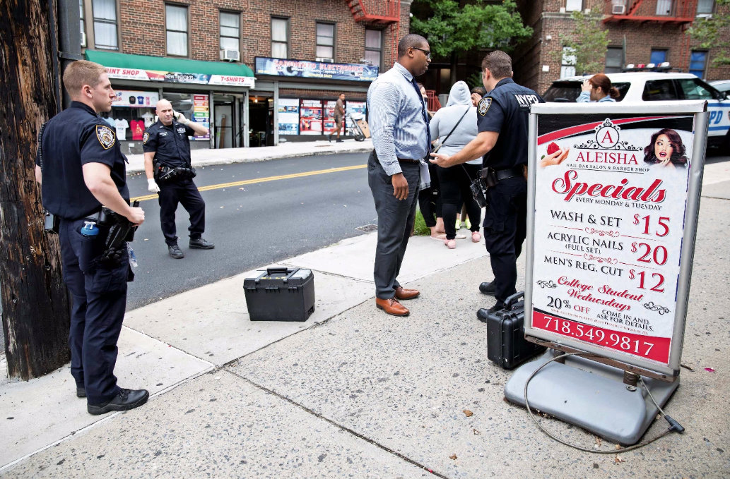 Police officers and detectives respond to a string of burglaries at three businesses on West 238th Street near Bailey Avenue in 2019. Burglaries are up, along with some other non-violent crime in the 50th Precinct, police — something they’re blaming on bail reform.