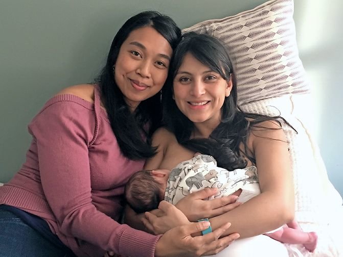 Myla Flores, a doula, visits with one of her clients and her newborn baby during a postpartum check-in. Flores, along with midwives and organizations around the city, is raising money to found the first midwife-lead birth center in the Bronx.