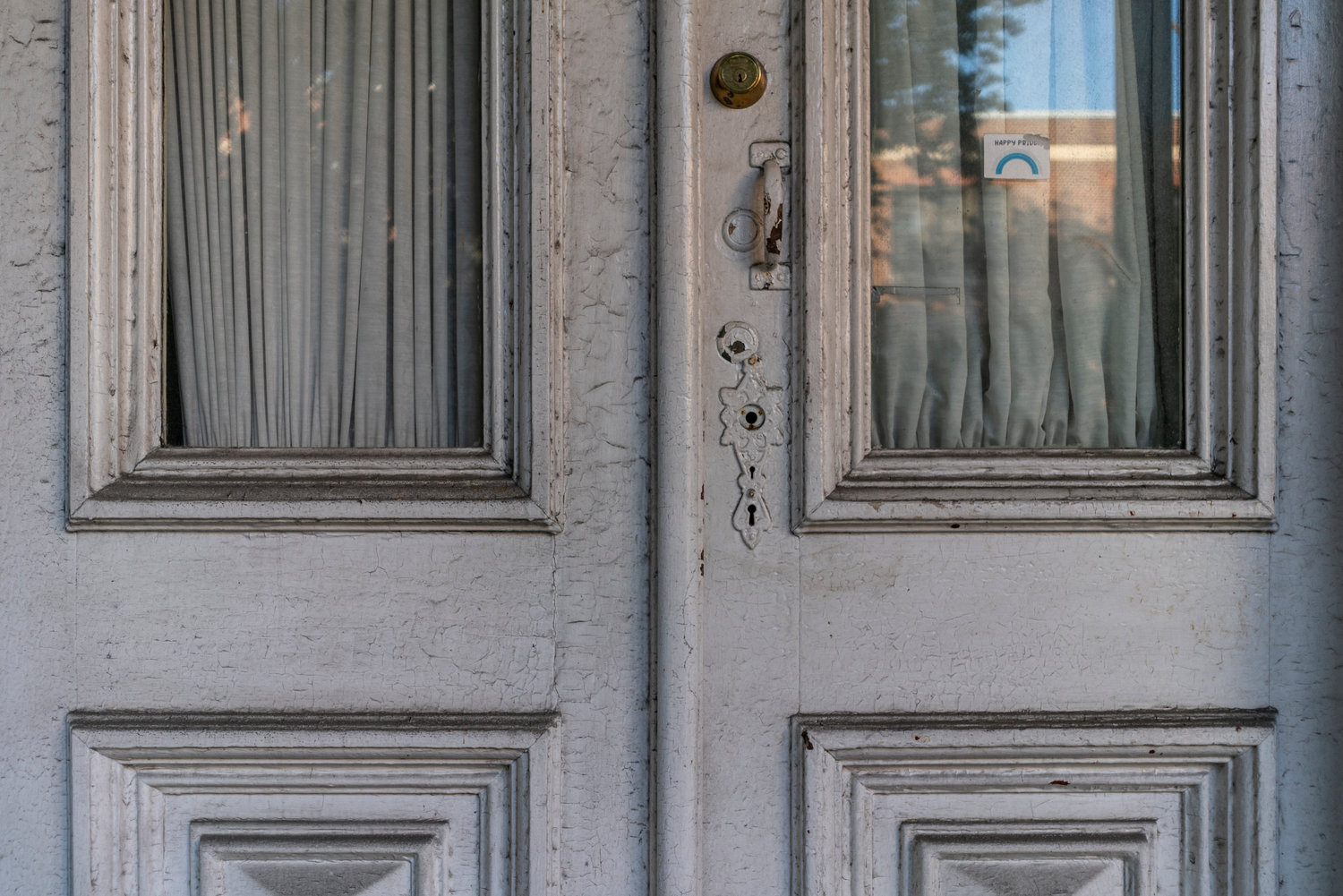 Chipping white paint covers the old doorknob and keyhole at 3029 Godwin Terrace. For the first time in decades, the home has changed hands, going to a nearby developer for $1.5 million, and almost ensuring its days are numbered.
