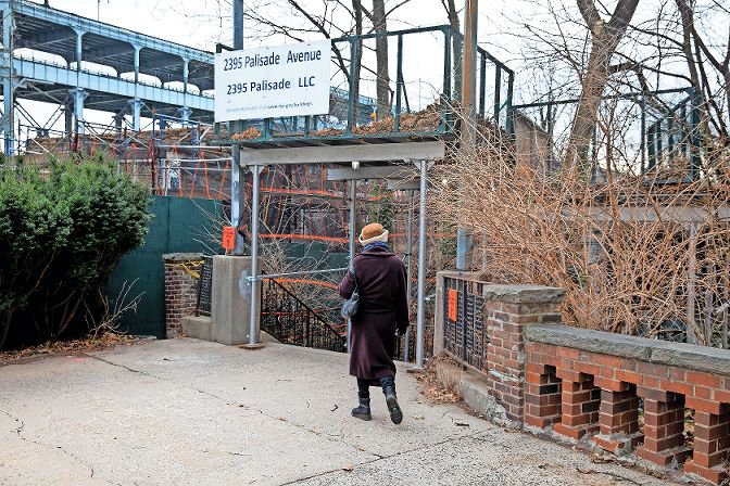 A woman walks toward Bradley Terrace, a step street Spuyten Duyvil activist Stephanie Coggins had hoped to ceremonially co-name after the former Villa Rosa Bonheur apartment building nearby, and its developer, John J. McKelvey Sr. However, Councilman Andrew Cohen ended that push by telling Coggins and other community groups no.