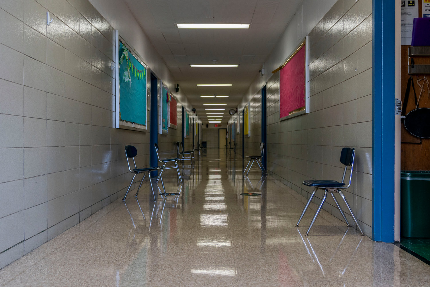 To avoid hallway crowding, each classroom at P.S. 24 Spuyten Duyvil has at least one chair outside for students to sit and wait to be called on by a hallway monitor. Measures like this will hopefully help keep public schools open as long as possible in the wake of the coronavirus pandemic.