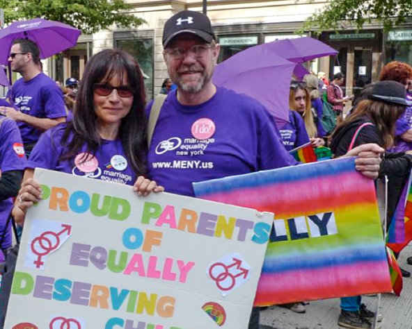 Some of George and RoseAnn Hermann’s advocacy comes from personal experience. They have three children, two of whom are gay, and are referenced on their protest signs from the 2009 March for Equality in Washington.
