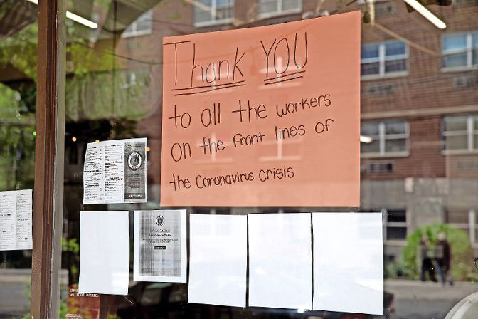 A sign in the window at Taste & Sabor on West 231st Street and Kingsbridge Avenue last spring thanks frontline workers for their efforts in fighting the pandemic. Although it seems two vaccines are on the horizon, Dr. Peter Marks from the Food and Drug Administration warns we still have a long way to go before we can find our ‘old’ normal again.