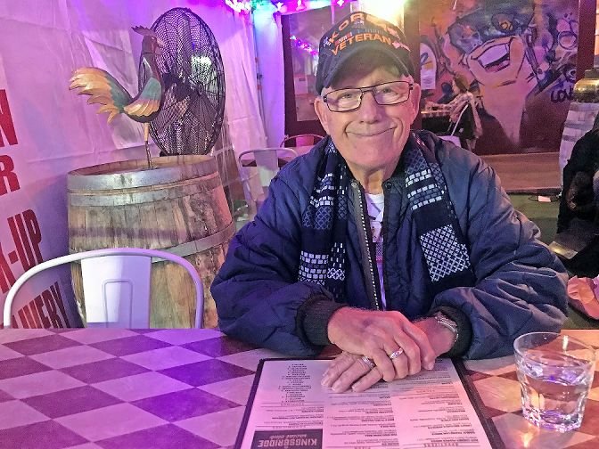 In what would be his first-ever trip to the Bronx in all of his 87 years on the planet, Richard Hinman gets ready to enjoy some grub at the Kingsbridge Social Club with his son, Riverdale Press editor Michael Hinman.
