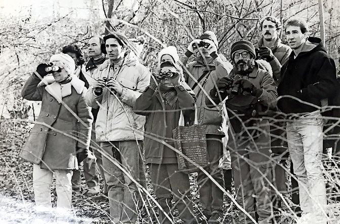 Armed only with binoculars, a group of bird watchers take a survey of their flying friends on the Wave Hill property just before Christmas 1986.