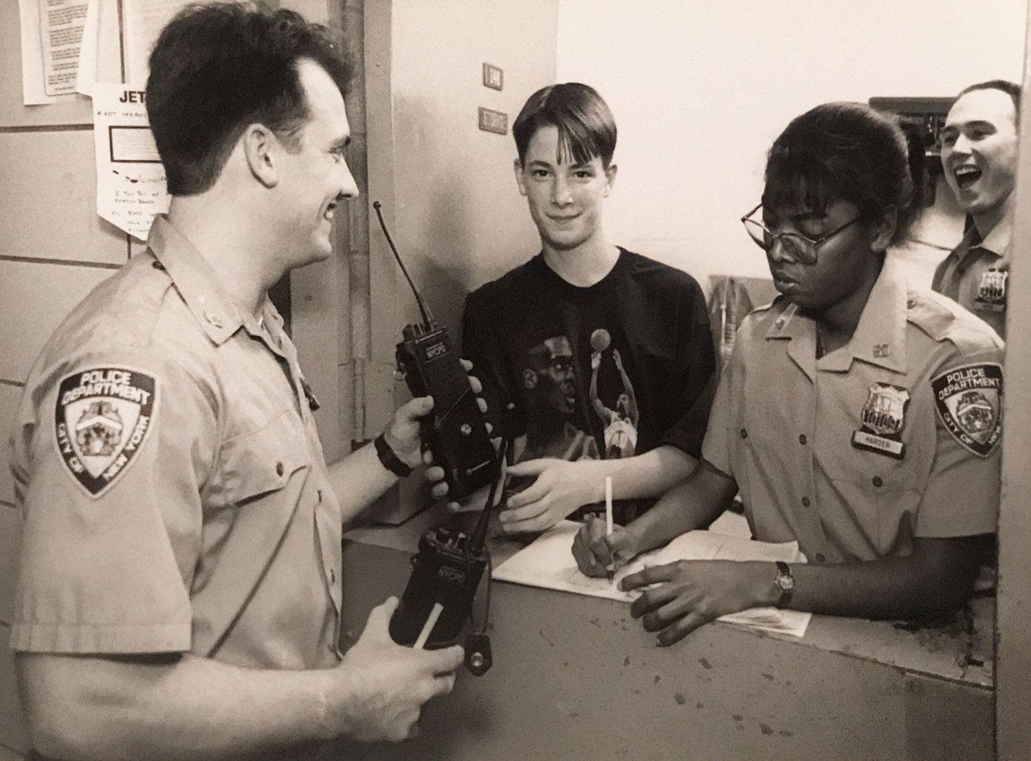Local school student Kevin Brown was 'commissioner for a day' of the 50th Precinct back in May 1994. After a roll call and an inspection, 'Commissioner' Brown handed out radios with Officer Audrey Harden to fellow officers like Rich Gleason.