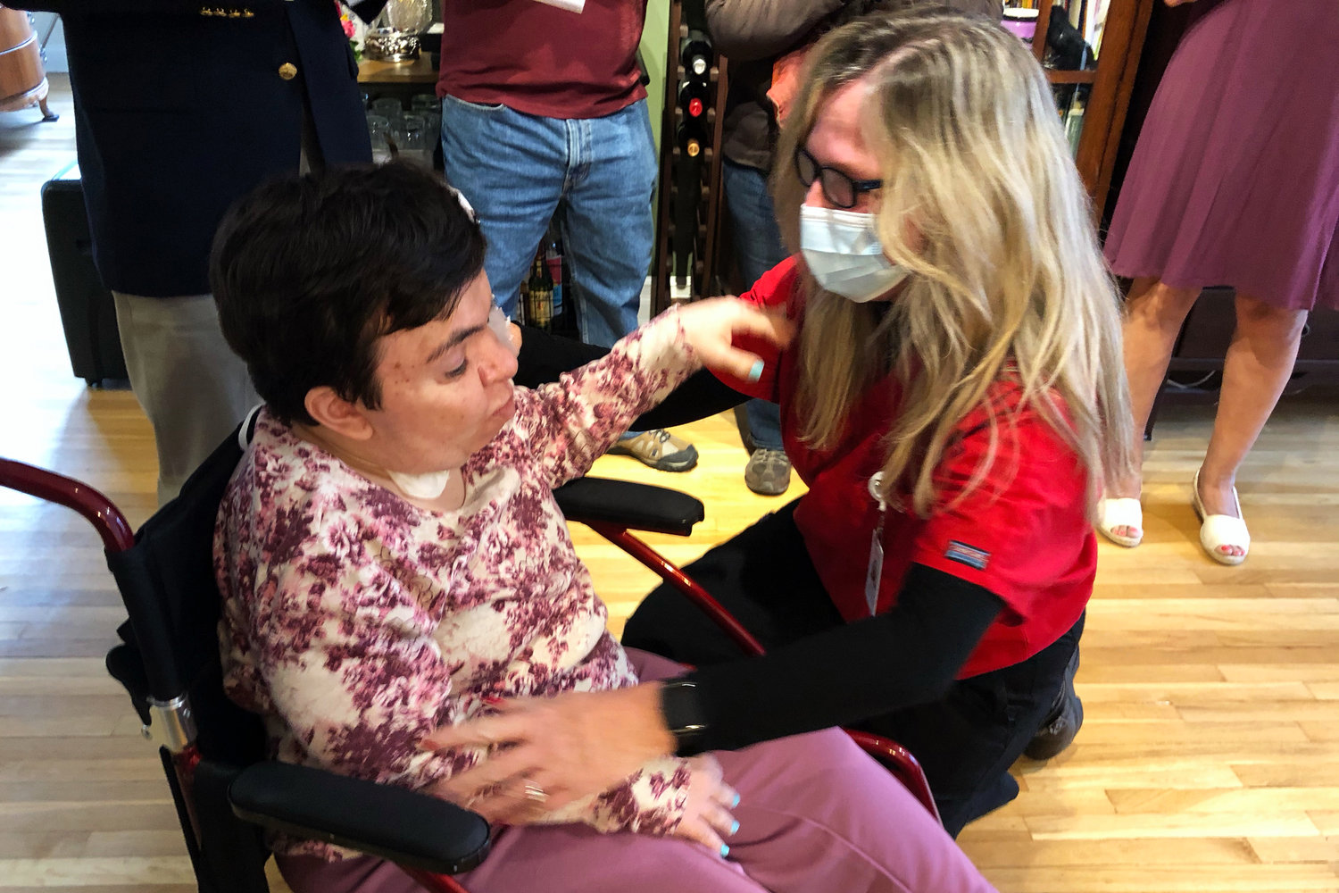 Lauren Wechsler, left, and Nancy Lonergan embrace after Lauren was presented with an honorary nursing certificate. Lauren dreamed of attending Columbia School of Nursing, but was never able to because of severe mental and physical disabilities.