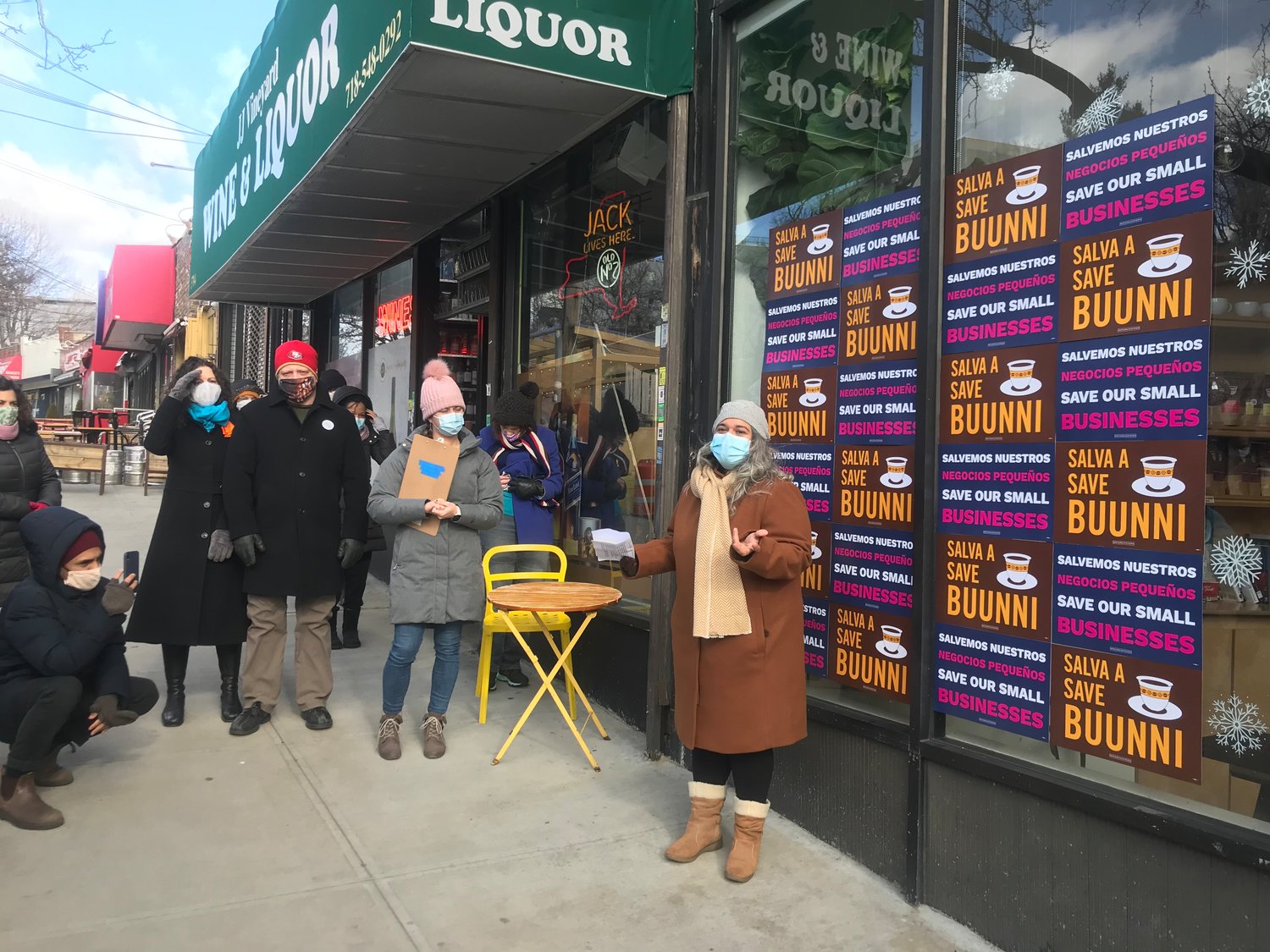 Buunni Coffee co-founder Sarina Prabasi talks to a crowd that rallied outside her 3207 Riverdale Ave., location Saturday afternoon, in the hopes to prevent the shop from closing for good on Sunday.