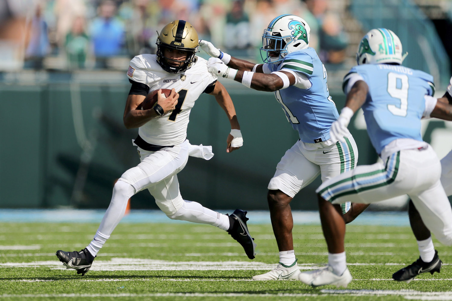 Army quarterback Christian Anderson tries to break loose from defenders in a November college football game against Tulane. Anderson helped West Point to a 9-3 record, culminating in a 24-21 loss against West Virginia in the AutoZone Liberty Bowl.