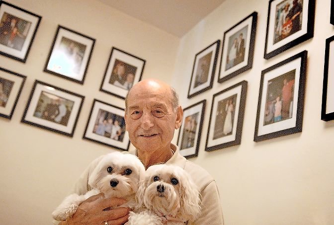 Sal Markowicz poses with Maltese dogs Rocky and Vegas in Rita and her husband's apartment at 3720 Independence Ave. in 2008.