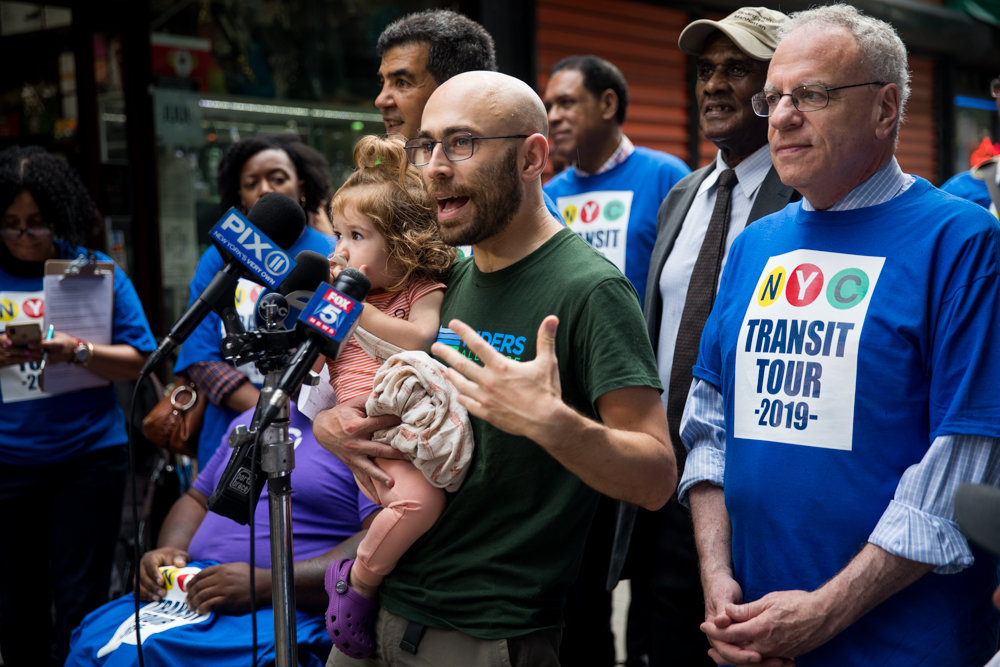 Danny Pearlstein, policy and communications director for Riders Alliance, calls on the Metropolitan Transportation Authority to do more to fix the city’s subway system at the start of the Riders Respond Transit Tour on Aug. 7. Pearlstein feels the MTA’s ‘cost neutral’ approach to fixing the borough’s beleaguered bus network will largely be ineffective.