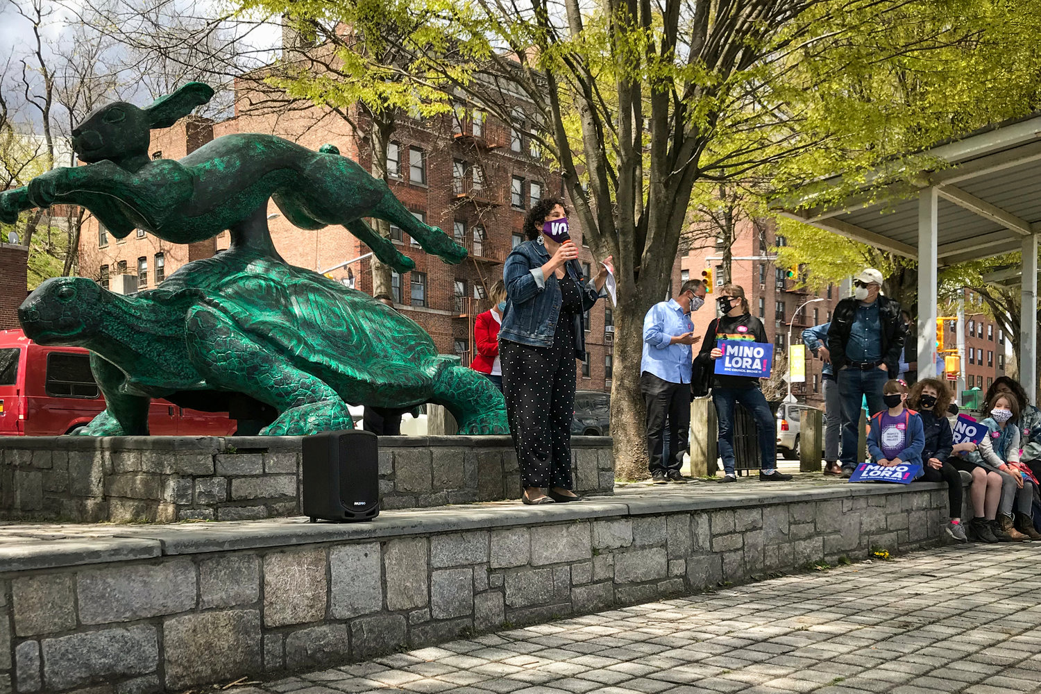 Speaking in front of the tortoise and hare statue at Van Cortlandt Park, Mino Lora rallies her supporters Sunday, officially kicking off her primary run to unseat Eric Dinowitz on the city council. She finished a distant second behind Dinowitz in the March 23 primary, but hopes to reverse that in the June 22 primary.