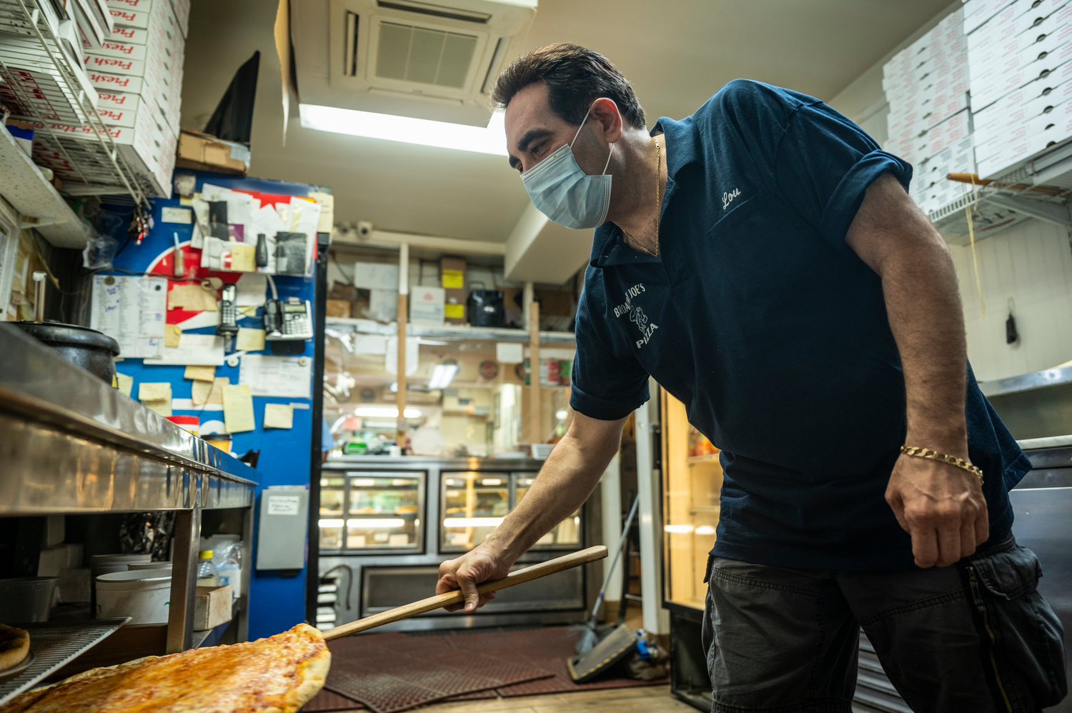 Broadway Joe’s owner Louis cooks the inspiration for Mayor Bill de Blasio’s voting simulation, which asks those looking to cast a ballot Tuesday to rank their top five pizza toppings.