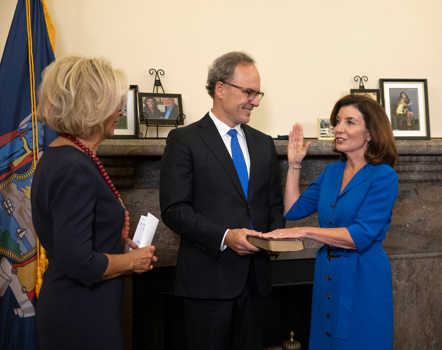 Kathy Hochul is sworn in as New York's 57th governor by chief judge Janet DiFiore while husband Bill Hochul holds the Bible. She will fill out the remainder of Andrew Cuomo's third term, who announced his resignation two weeks ago after a sexual harassment scandal rocked his office.