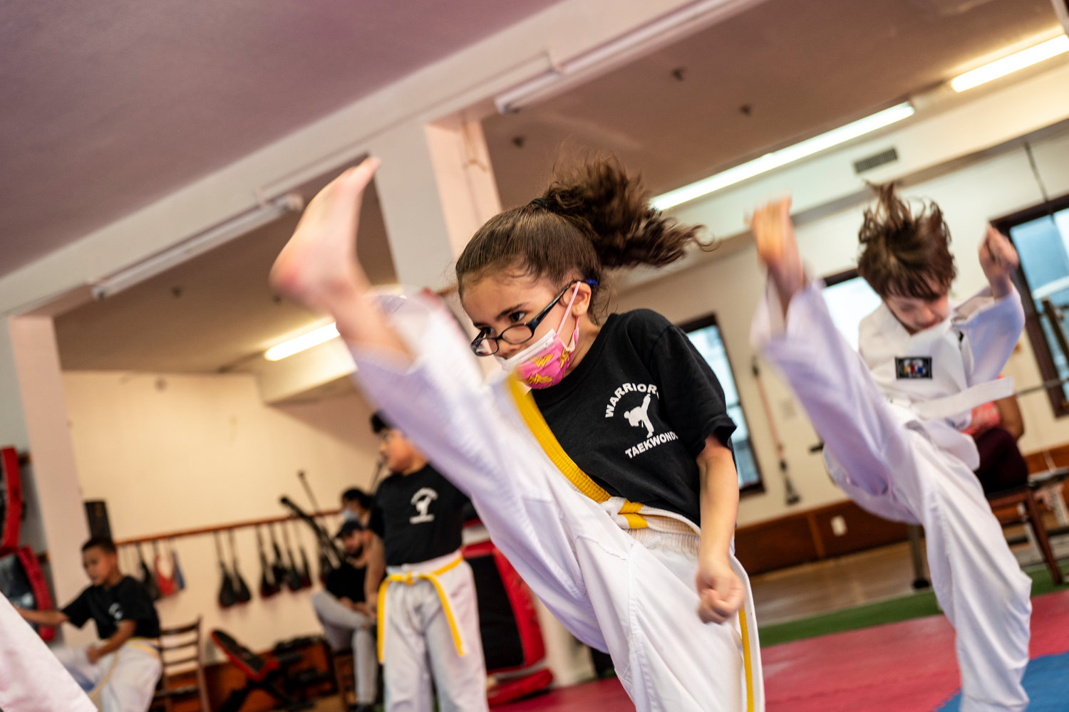 HIRAM ALEJANDRO DURÁN
Students at Warriors Taekwondo practice high-sweeping kicks at the group’s Inwood dojo. Raj Rajput, who owns this another in Riverdale — hopes that with students returning to school, he’ll make enough money to start paying back some of the back rent he owes.
