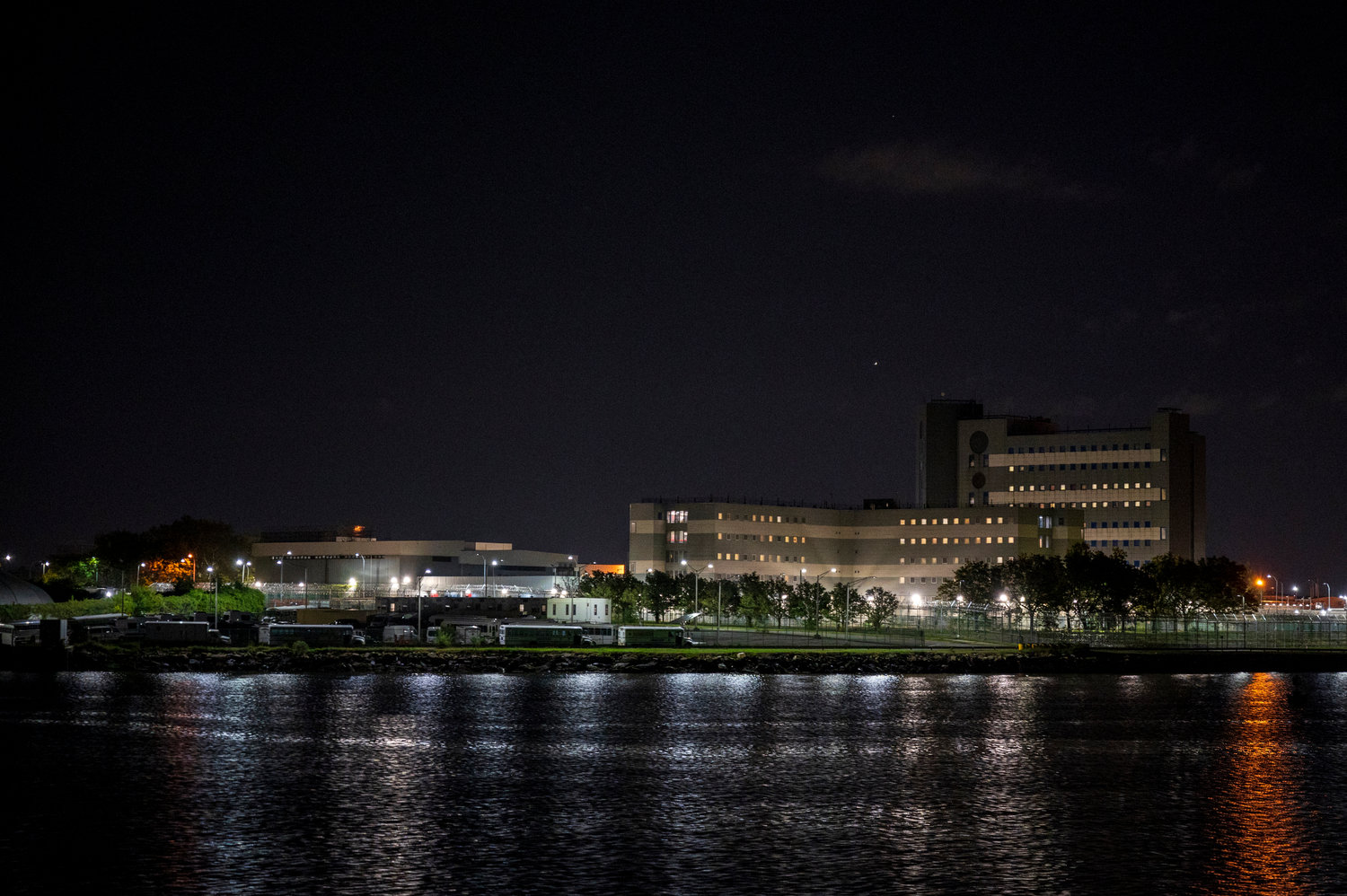 The massive jail facility of Rikers Island looms across the East River, even from Barretto Point Park. Mayor Bill de Blasio has pushed to spend billions of dollars to close the facility, but what’s happening behind those walls in the meantime?