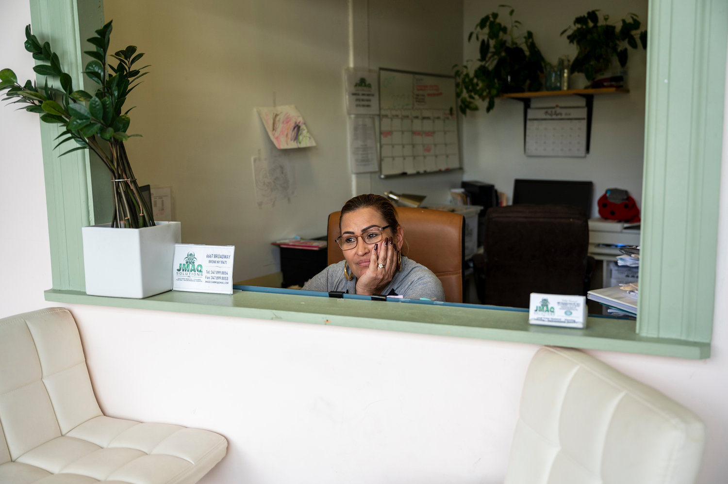 Jackie Maquilon helps her family at the front desk of JMaq Cleaning Solutions on Broadway and West 262nd Street. They have been collectively running the business since her ex-husband died last spring. If the city moves forward with its plan to build a men’s homeless shelter at 6661 Broadway, the family would have to part ways with their business location.