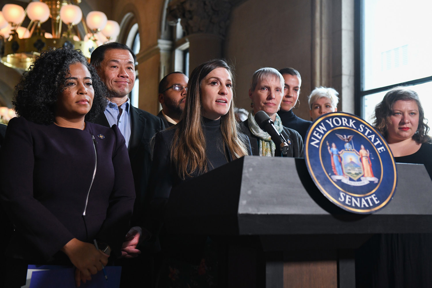 NY state Sen. Alessandra Biaggi, shown holding a press conference about an abortion access fund, Despite the high court decision nixing the new state and congressional district maps, she continues to campaign for the 3rd congressional district.