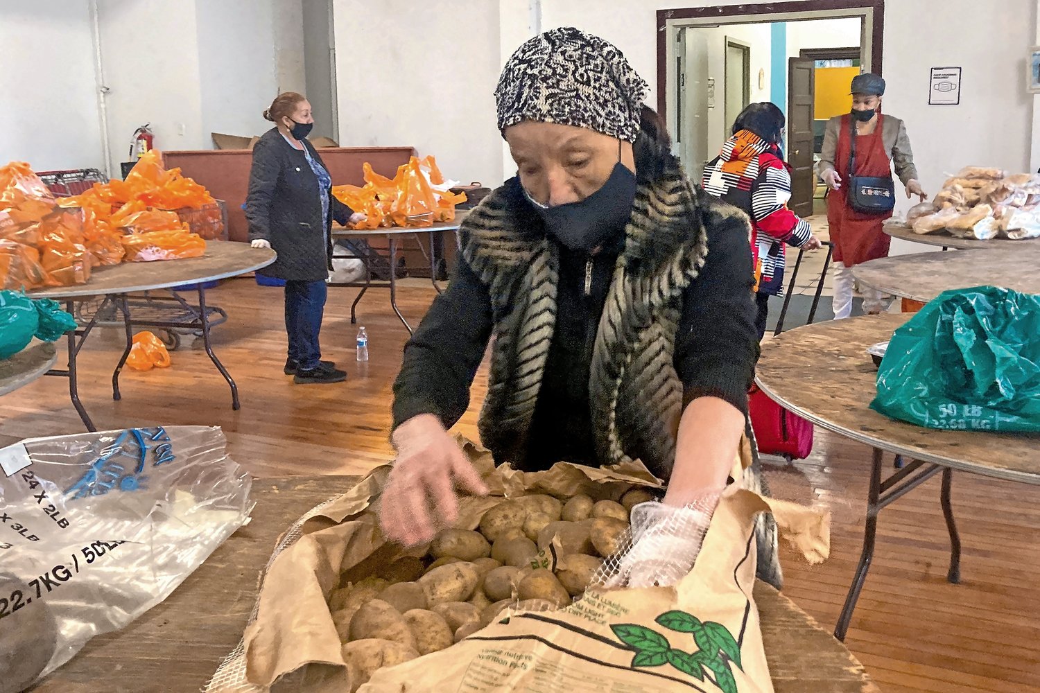 Organizers at the Church of the Mediator work all day to help provide hundreds of Kingsbridge residents the food they will need for the week.