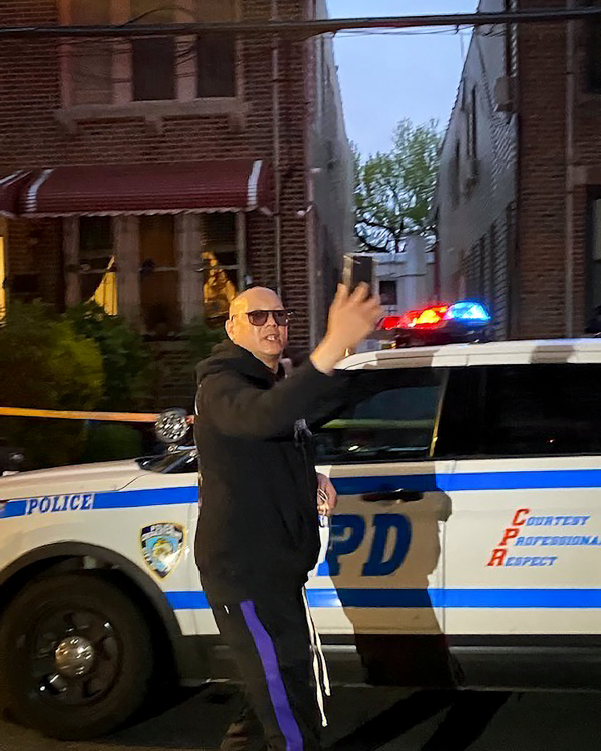 An unidentified person who acknowledged knowing Daniel Valdez, who was shot to death at his home in Kingsbridge May 2, takes a selfie video at the crime scene.