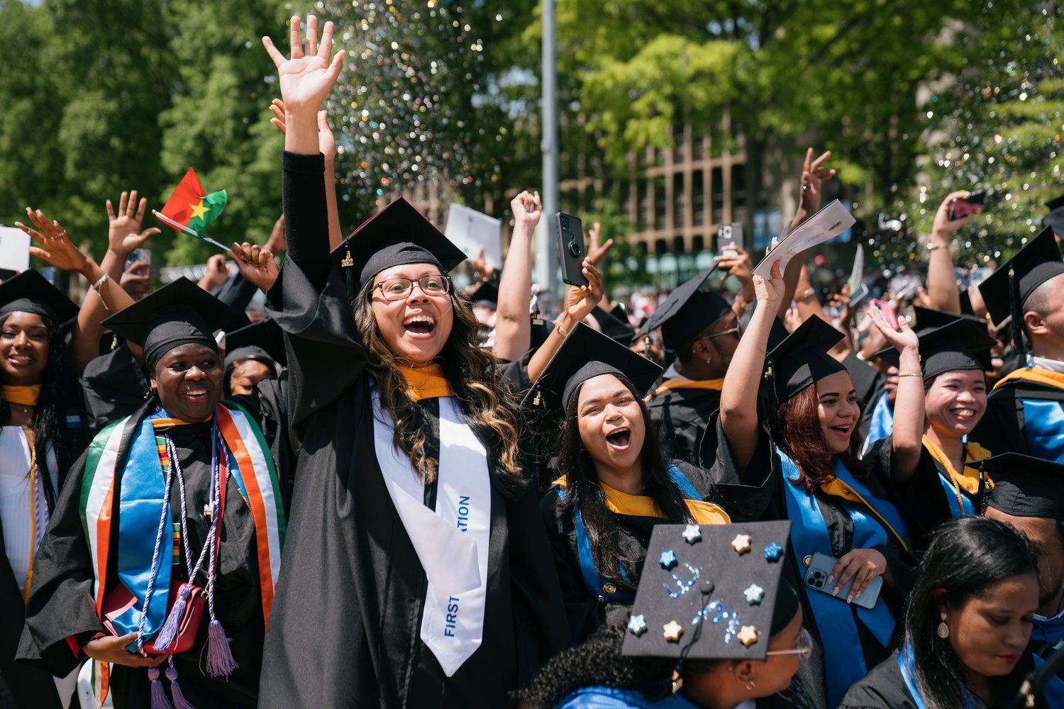 Graduates celebrate during Lehman College’s 2022 commencement May 26 on campus. The school was one of many CUNY schools to hold a live outdoor commencement for the first time since the coronavirus pandemic began.
