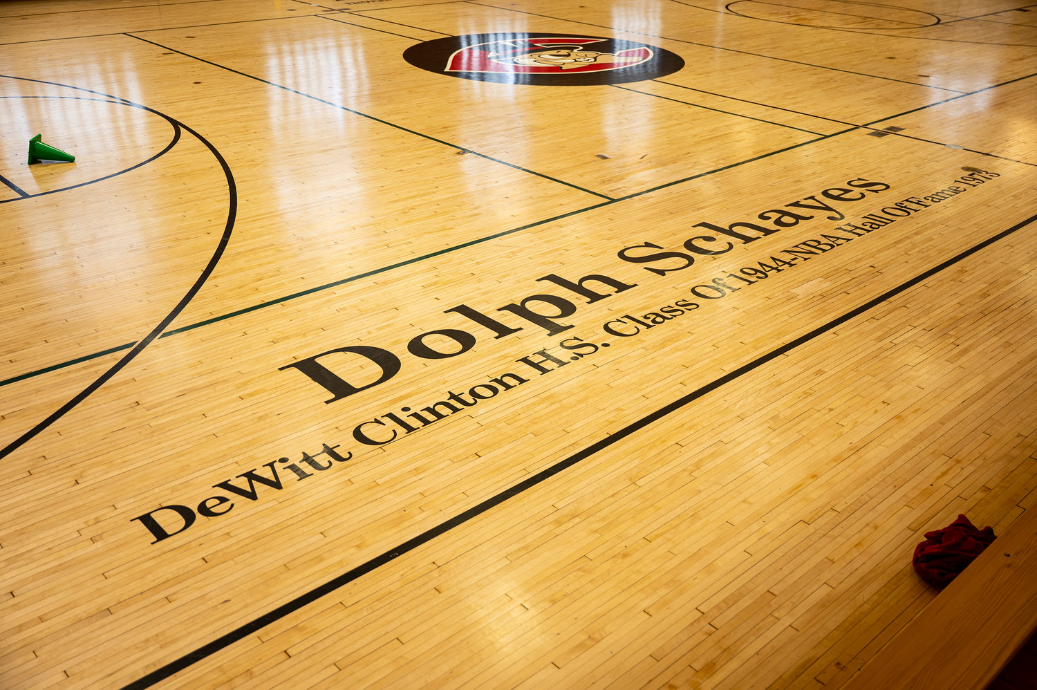 Nate (Tiny) Archibald, is one of two people to have his name painted on the floor of DeWitt Clinton High School’s gym. When Clinton principal Pierre Orbe the Hall of Fame NBA star to allow his name to be included in the gym, Archibald said only if his name was added next to the late Dolph Schayes, who played for the team that would eventually become the Philadelphia 76ers.