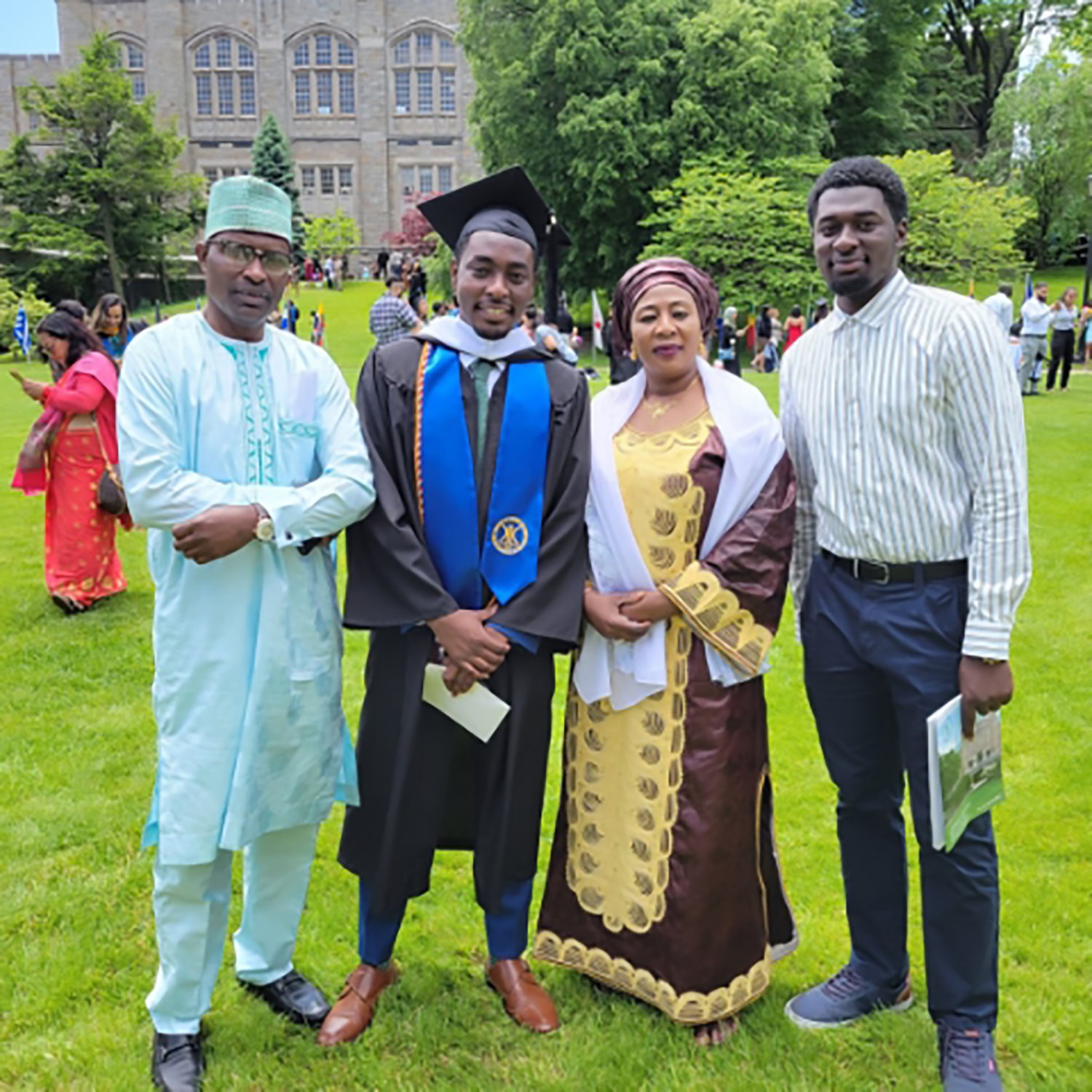 Hussein Abdul's family, from left at the Lehman College graduation, include his father Abdul Hussein, his mother Zalia Musah, and his brother Hashim Abdul. Hussein collected his political science degree on May 26 in a ceremony that was kept as a surprise from Abdul's parents. On top of that, they were not aware he was chosen as one of the ceremony’s speakers.