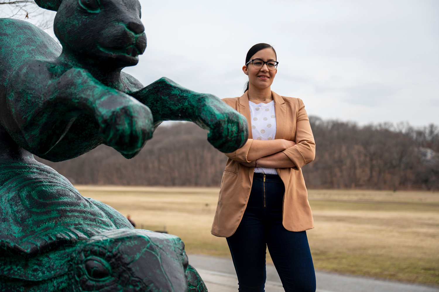 Miguelina Camilo stands for a portrait near the Tortoise & Hare sculpture at Van Cortlandt Park earlier this year. She got the Bronx Democratic Party's endorsement in the senate's newly drawn 33rd district.