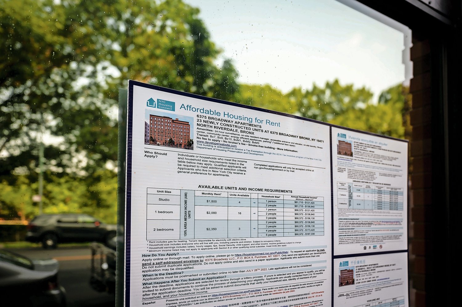 The income requirements breakdown on a board near the main entrance of 6327 Broadway on Wednesday, July 20, 2022.