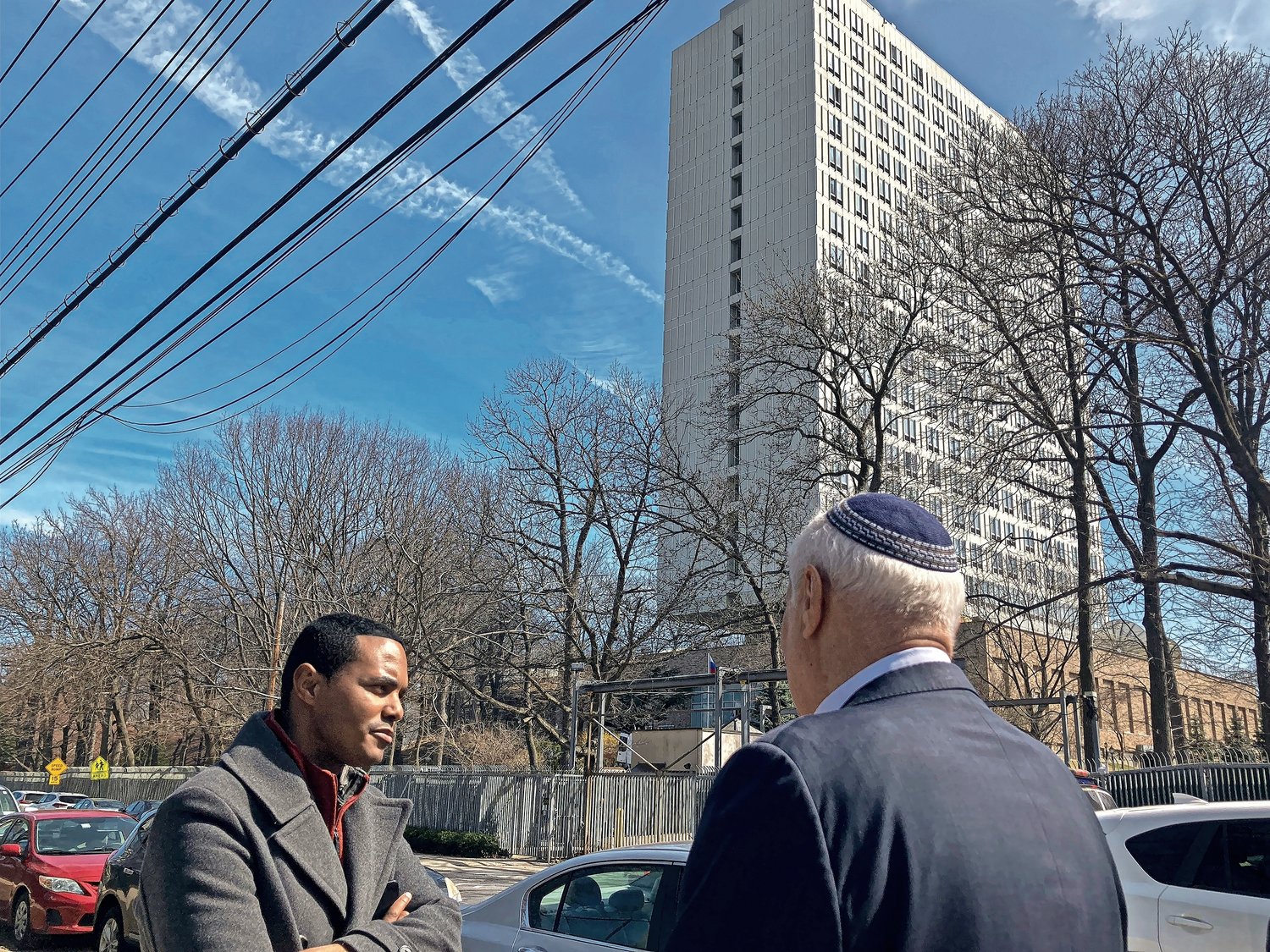 U.S. Rep. Ritchie Torres, left, meets with Rabbi Avi Weiss outside of the Russian Mission compound on North Riverdale's Mosholu Avenue in March. Torres wants the FBI to investigate whether the diplomatic residential complex that towers over the Riverdale Library and the Riverdale Neighborhood House also serves as home to spies loyal to Russian president Vladimir Putin.
