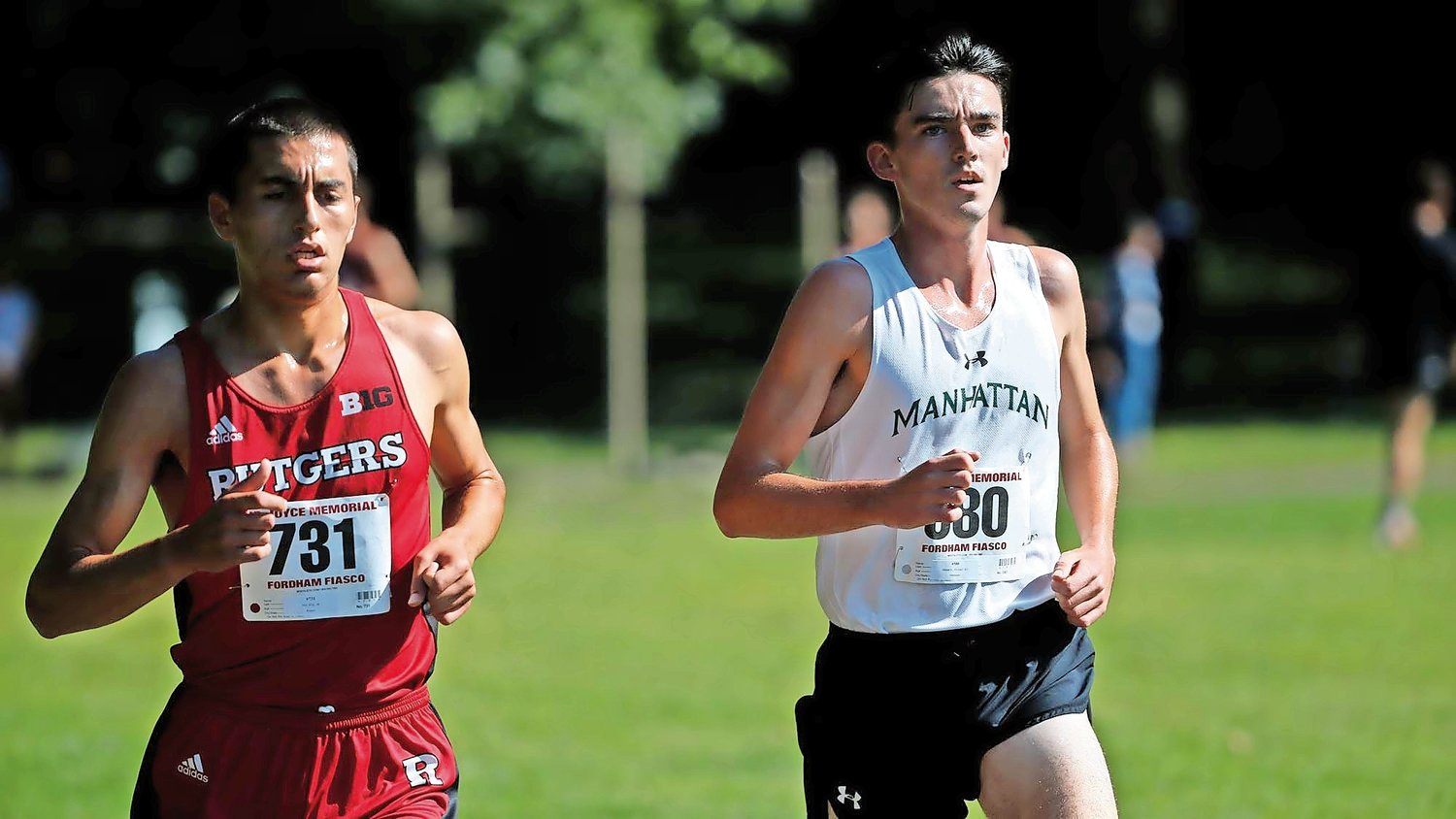 Michael Hennelly, right, is entering his fifth season for the Manhattan College cross-country team. For one weekend this summer, Hennelly traded Riverdale for Utica where he won the famed Boilermaker 5K.