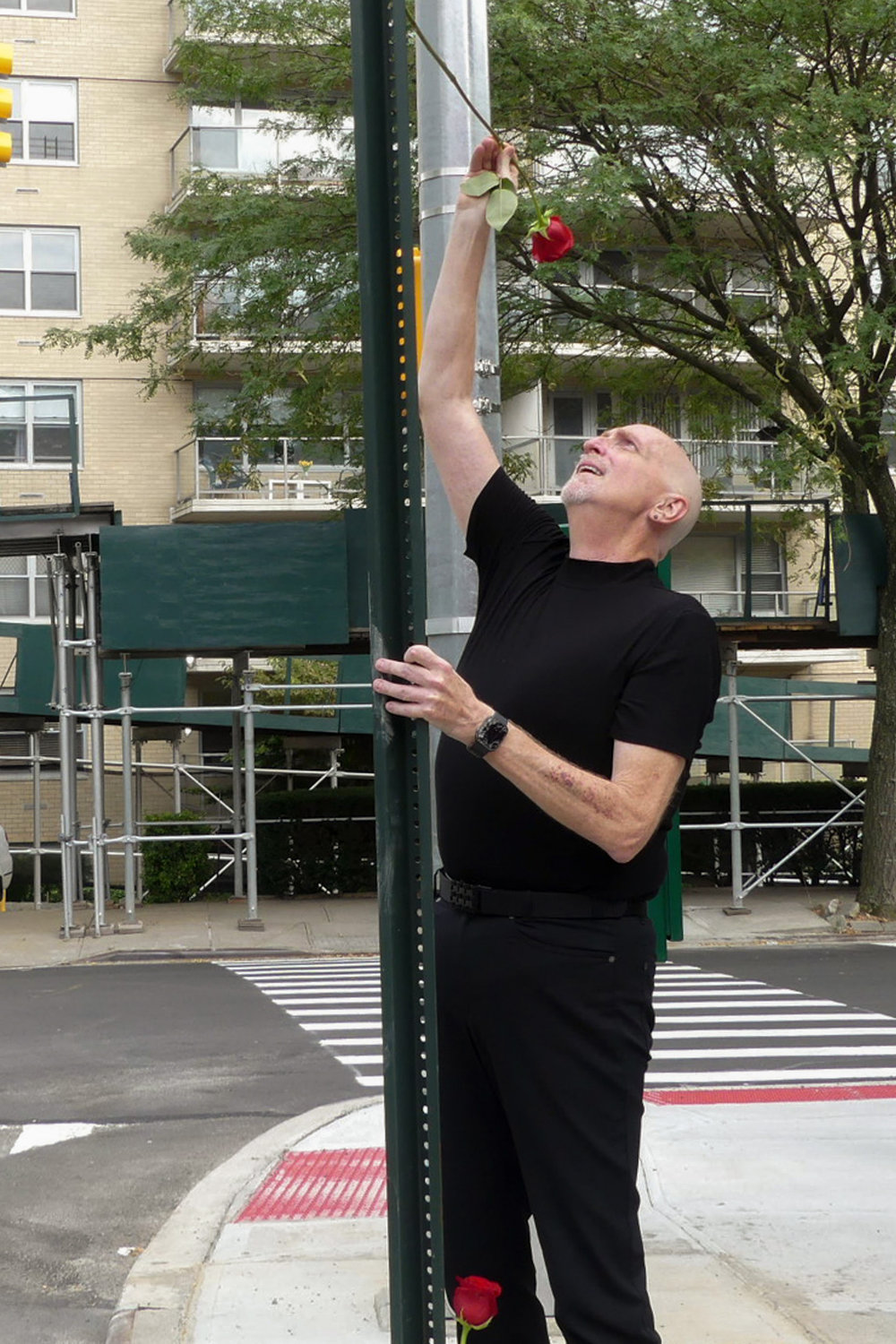 Jim Bradley places a rose in memory of Ruth Mullen at the corner of Johnson and Kappock in Riverdale, NY on Septmeber 4, 2022.