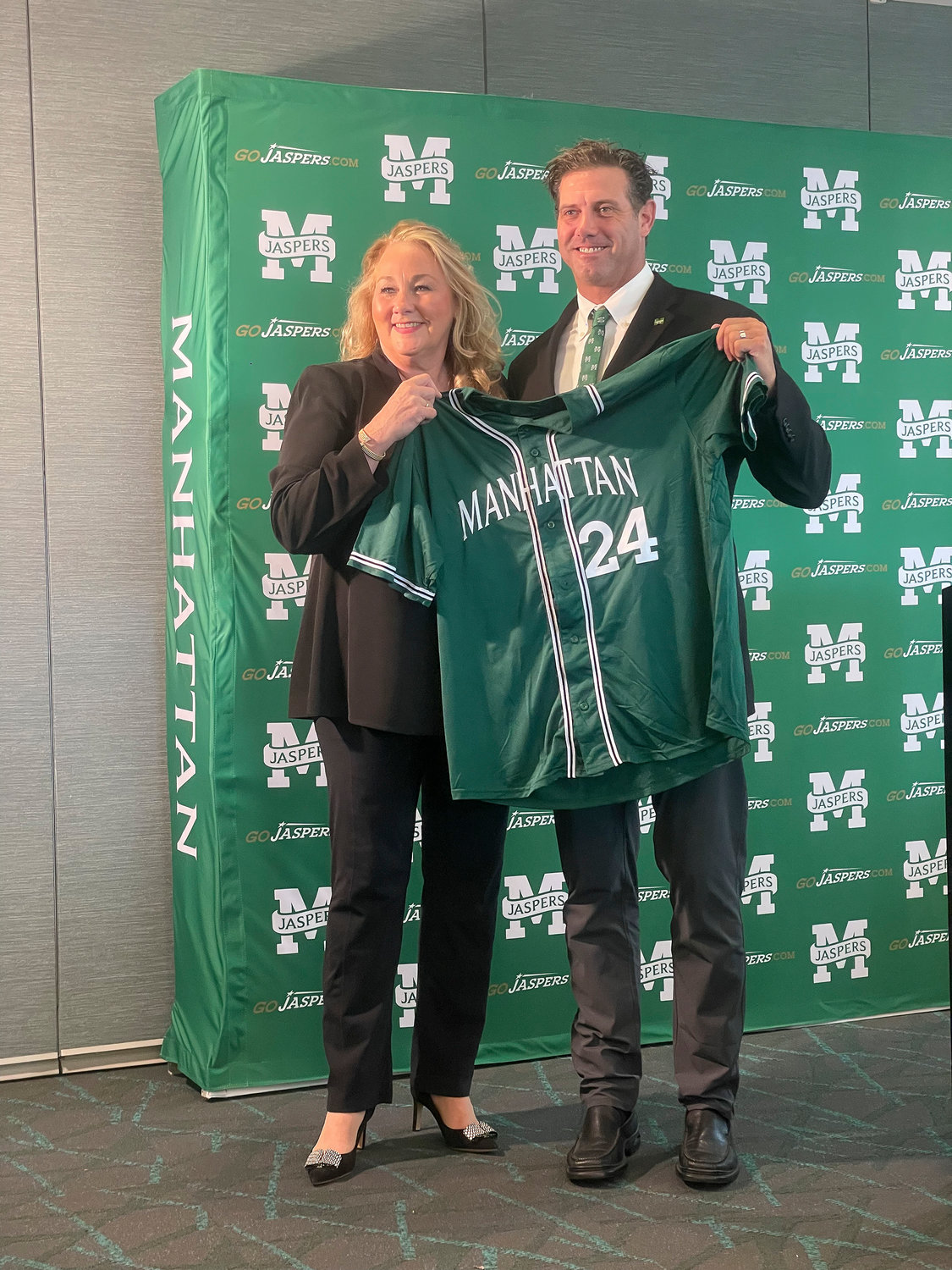 Manhattan College Director of Intercollegiate Athletics Marianne Reilly announces the hiring of former MLB player David Miller as the new Jaspers baseball head coach last week.