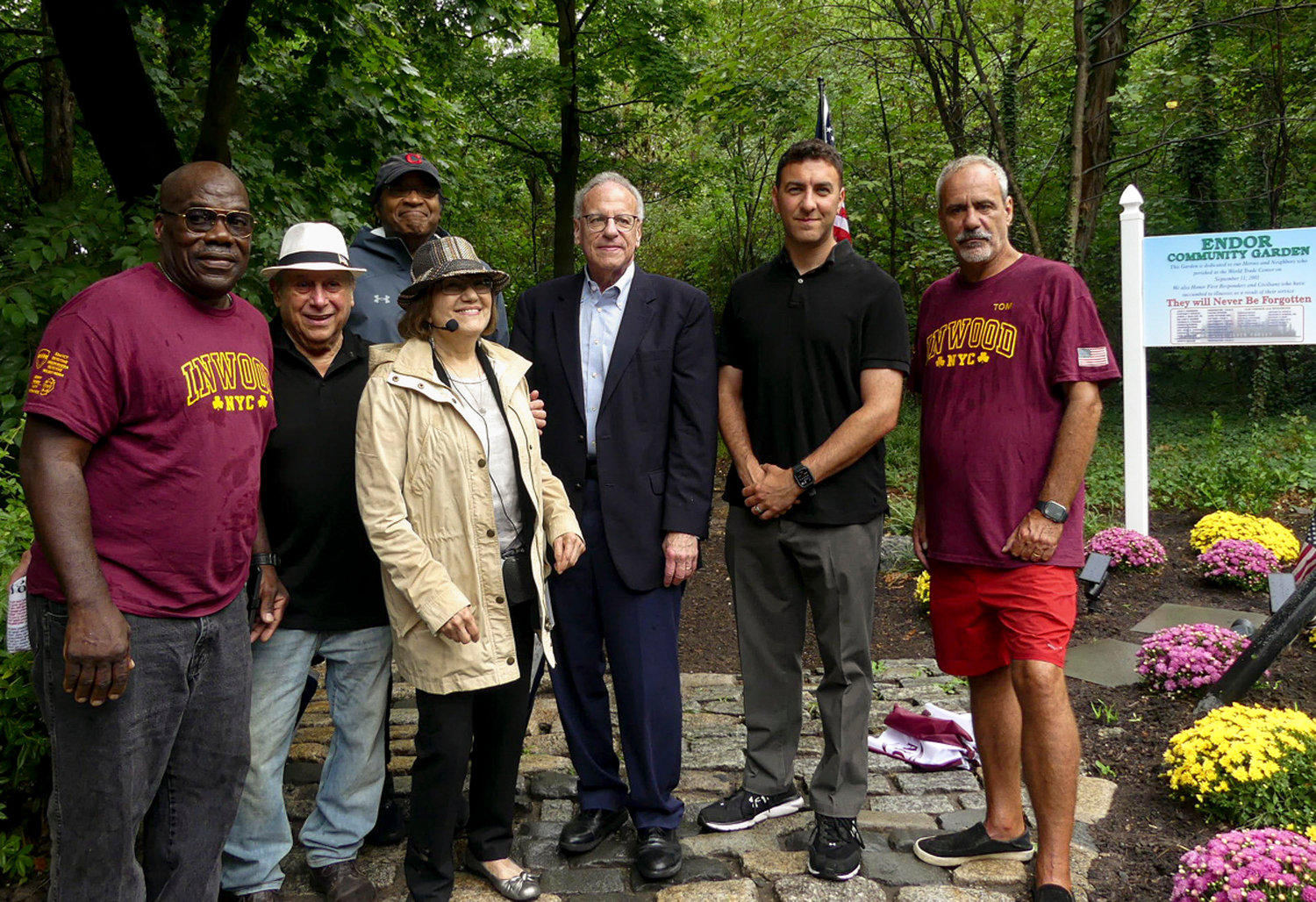 Riverdale community members including Rob and Laura Spalter, assemblyman Jeffrey Dinowitz and council member Eric Dinowitz at the 9/11 memorial at Endor Community Garden in Riverdale, NY on the 21st anniversary of 9/11. September 11, 2022.