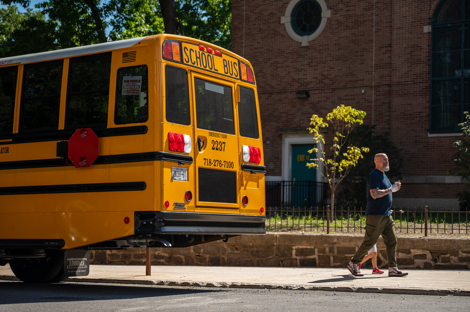 A school bus parked outside of P.S. 81 waits for students on Sept. 14. A state-wide ballot referendum would address zero-emission school buses.