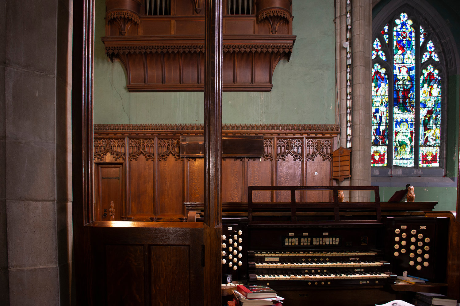Open hymnals lay strewn on the consul of the Episcopal Church of the Mediator's 1,176-pipe Boston Skinner organ, built in 1923, and still used in Sunday services.