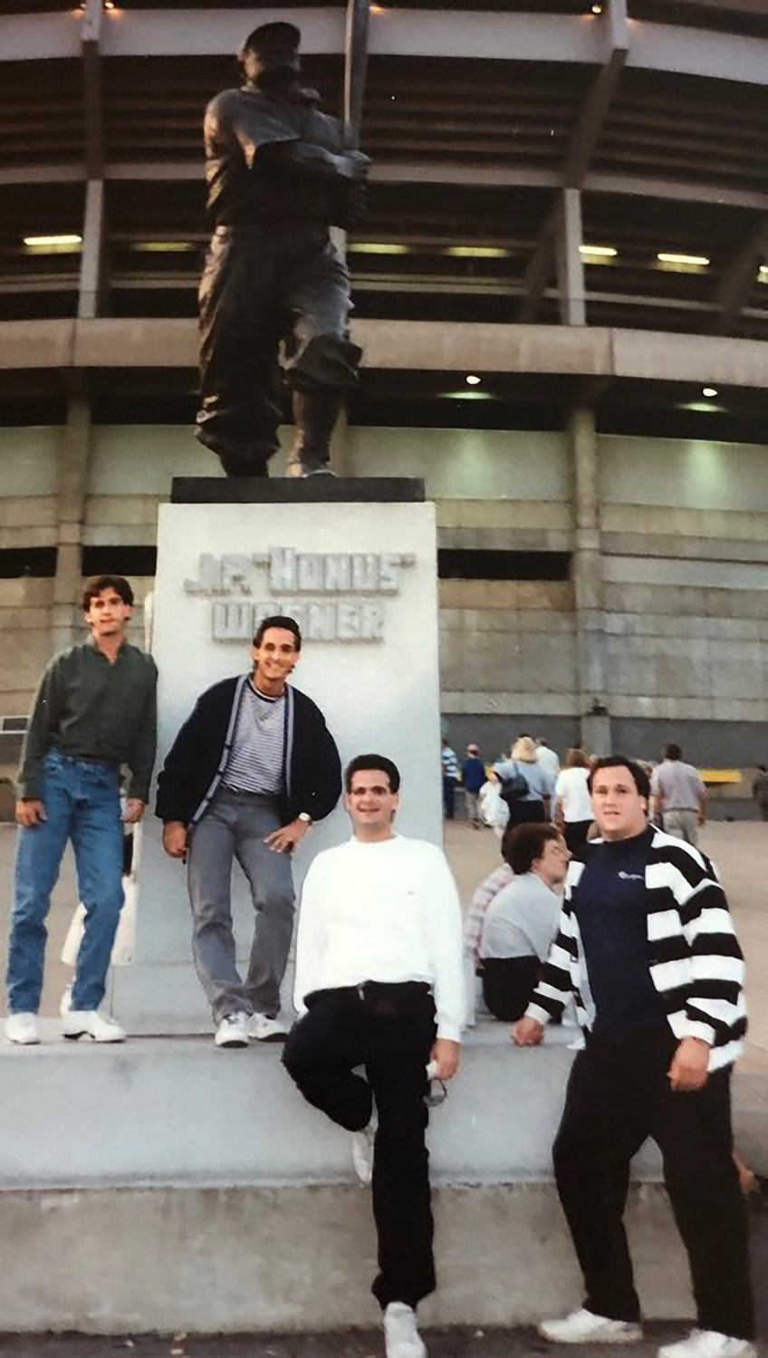 During one of their earlier “man trips,” Rick Hoffman, Alan Hoffman, Mitch Gill and Lee Gallo stand in front of the Honus Wagner statue at Pittsburgh’s Three Rivers Stadium in the 1990s.