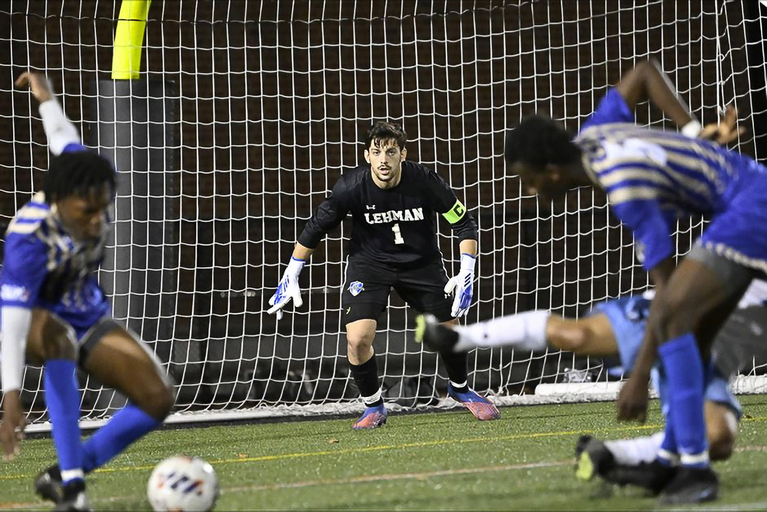 Lehman College goalie Demiraldo Grunasi awaits a shot on goal by a Johns Hopkins’ forward during the NCAA Div. III men’s soccer tournament in Baltimore Nov. 12. The Lightning lost, 3-0, in the opening round affair.