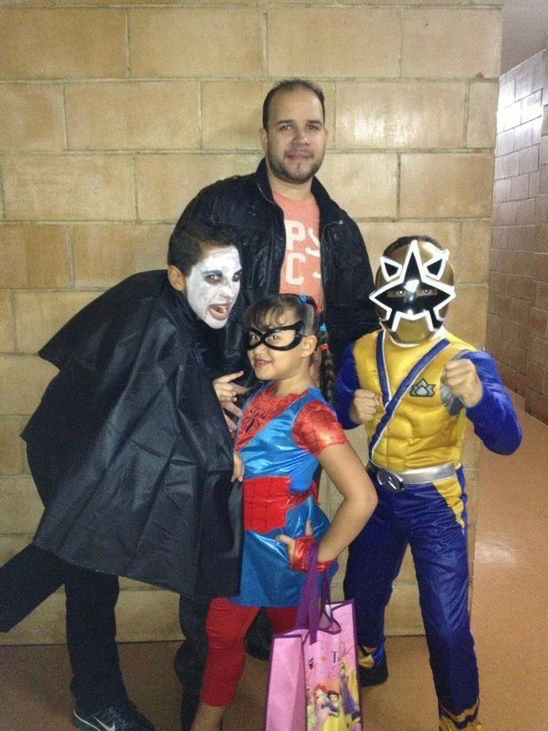 A much younger Angellyh Yambo on Halloween with her family. She would regularly visit her dad's workplace for trick or treating. Manuel Yambo is a night doorman at The Glen Briar co-op in Riverdale.
